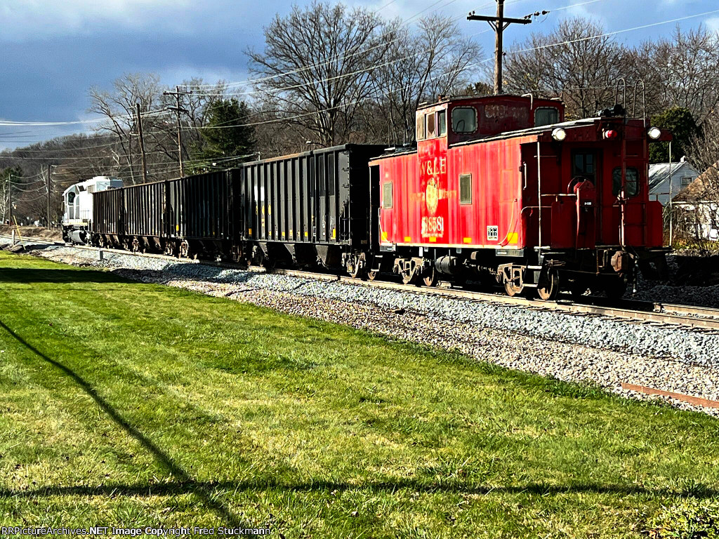 WE 6992 waits at the far end.